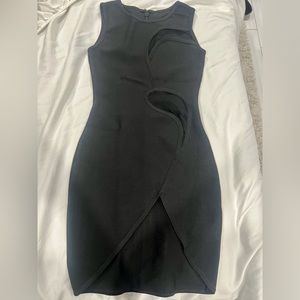 Sexy black mini dress with sheer cutouts and a slit